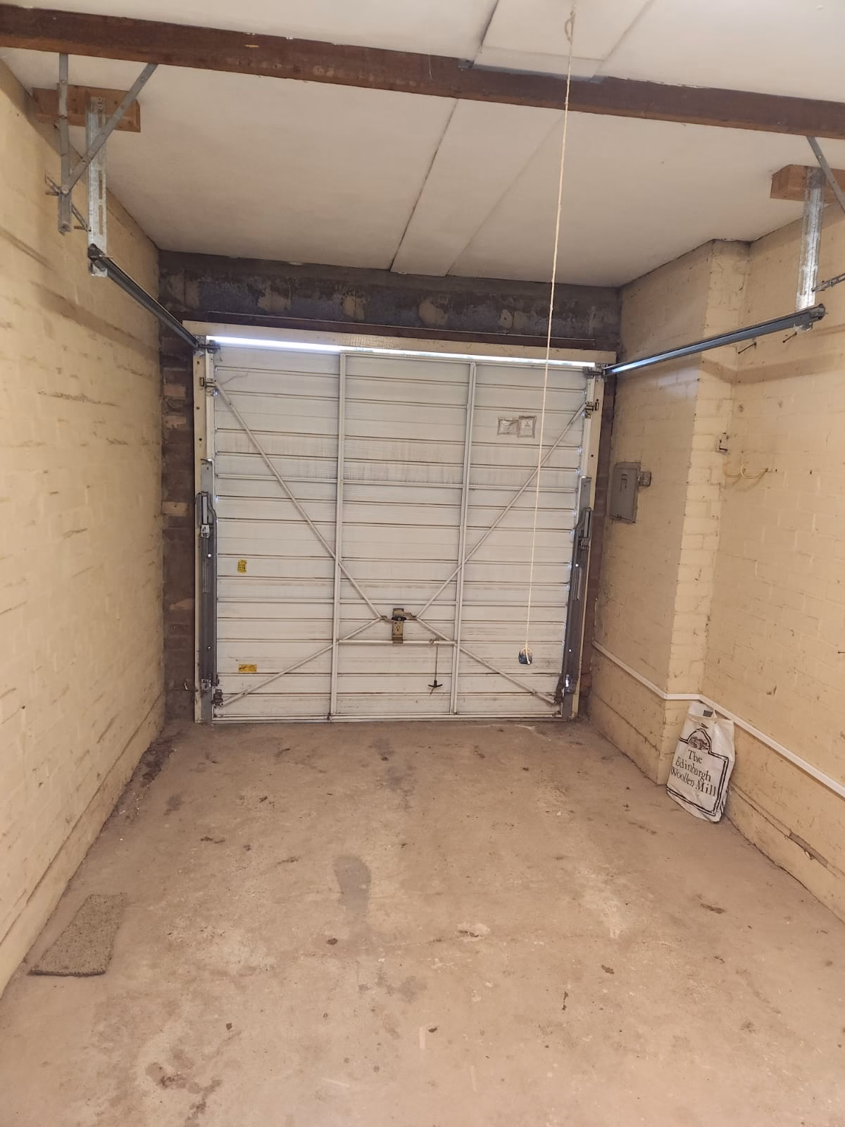 Garage before conversion in North London by Fixiz