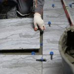 Fixiz handyman installing tiles